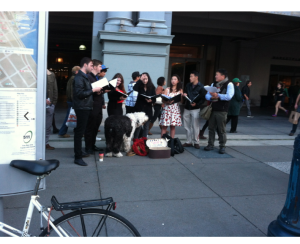 Carolers singing at the foot of the Ferry Building